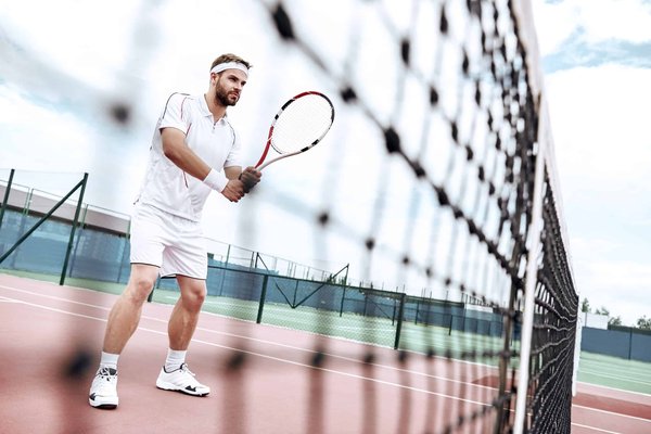 How Can Tennis Players Use Ball Machine Drills to Improve Serve Consistency?